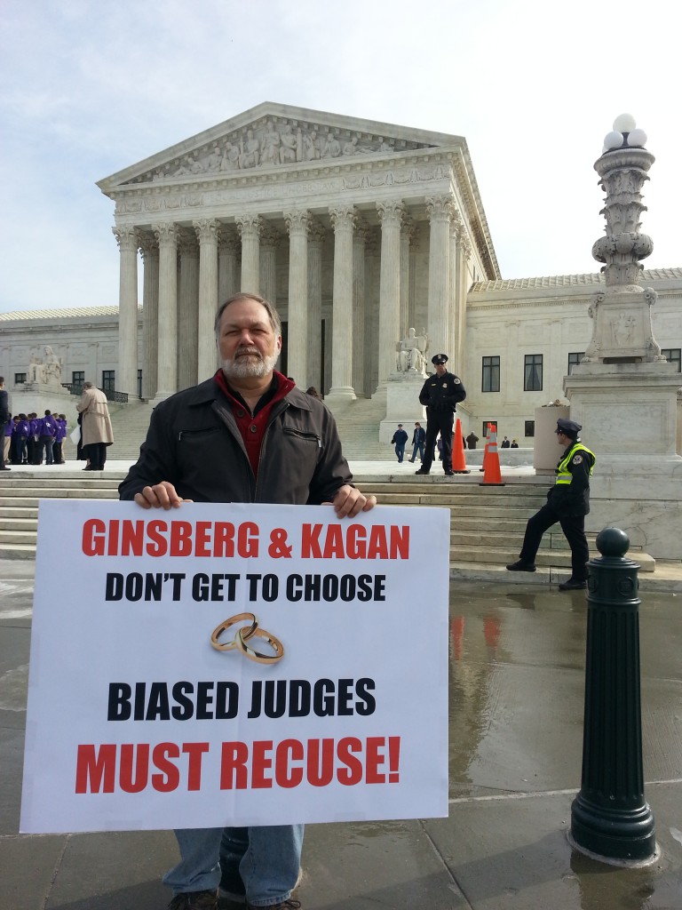 Dr. Scott Lively at the United States Supreme Court.  The sign demands the recusal of Justices Ginsberg and Kagan, both of whom have officiated at same-sex "weddings" and thus proven themselves incapable of impartiality on the "gay marriage" question that is before the court.    